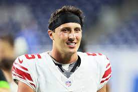 Tommy Devito smiles after his first NFL Game. He had an amazing game with 227 yards and 2 touchdowns.