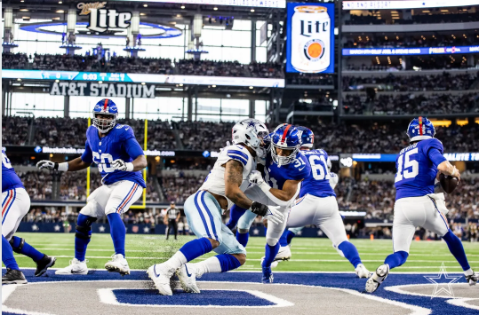 The Giants try to find a way to avoid a huge loss. The Cowboys defense pushed through to get the safety on Tommy DeVito.
