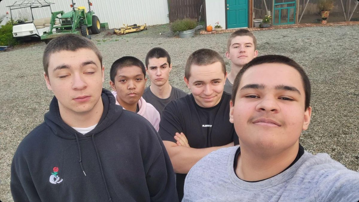 Gage with his friends Kaleb P(on the very left), Dakota (DJ)(left and above kaleb), Xavi(in the very back), Darvin(in the middle), Blake (in the right back), and Gage (taking the picture which is on the very right)