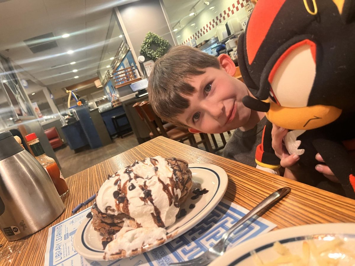 SRA Student Sidney Danger shares a stack of Chaos Chocolate Pancakes with Shadow the Hedgehog