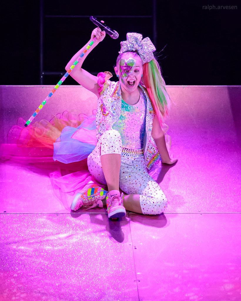 JoJo Siwa live at a concert. Siwa is one of the many stars to have a drastic change in appearance due to early fame.