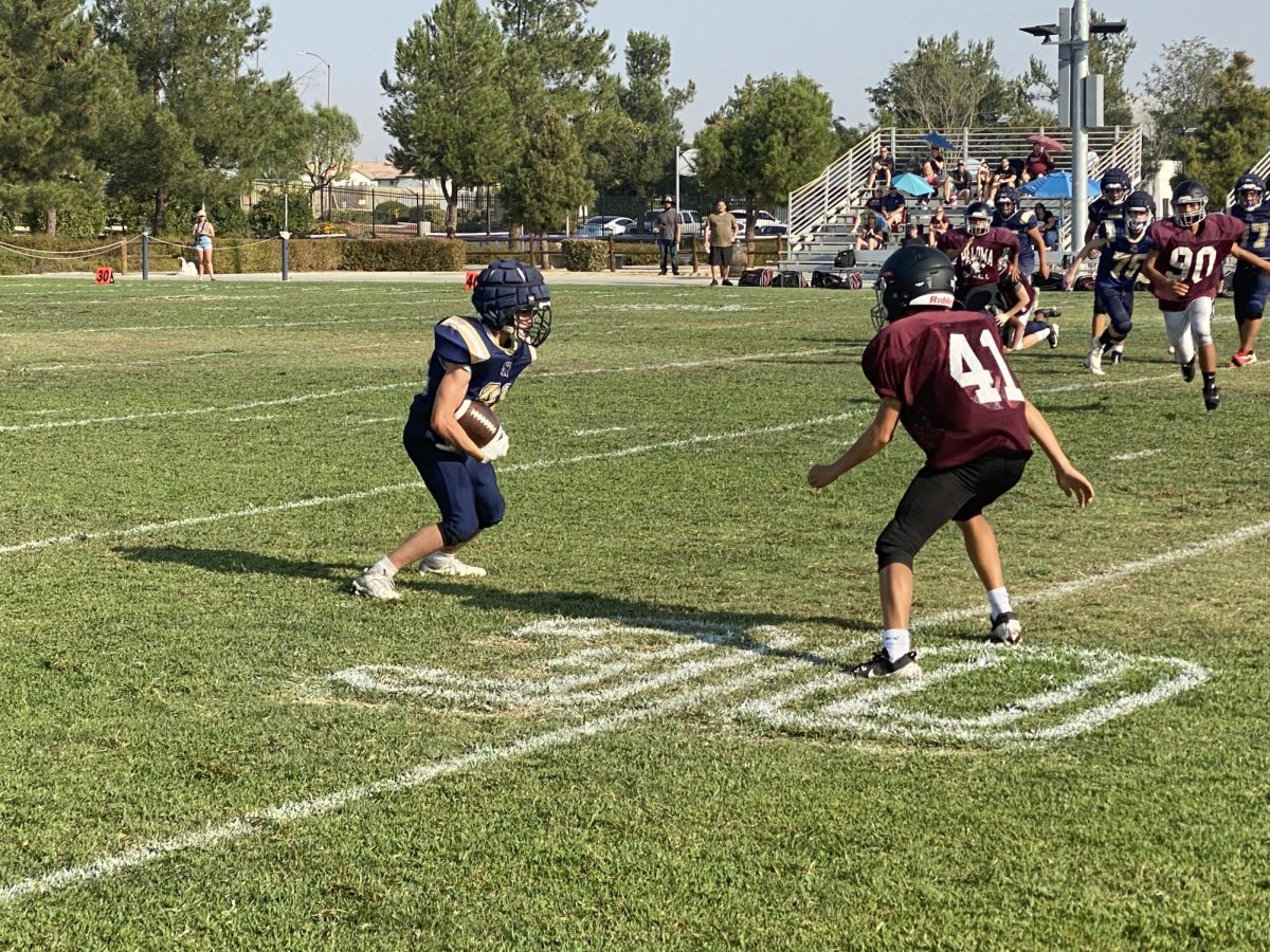 SRA Frosh player Thomas Little juking #41 in game against Paloma Valley High School