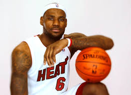 Lebron James focuses on the camera with a handsome stare in his Miami Heat Uniform.