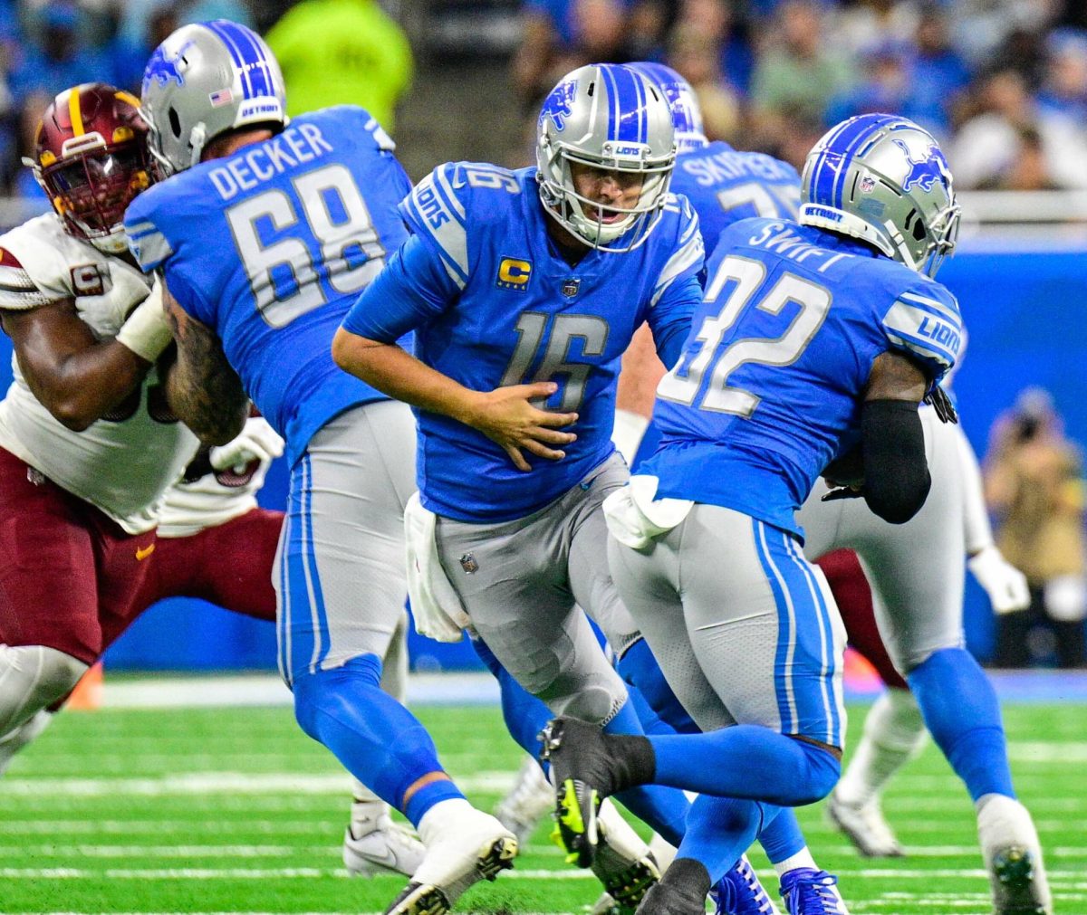 Jared Goff facing off against the Commanders at Ford Field in Detroit MI