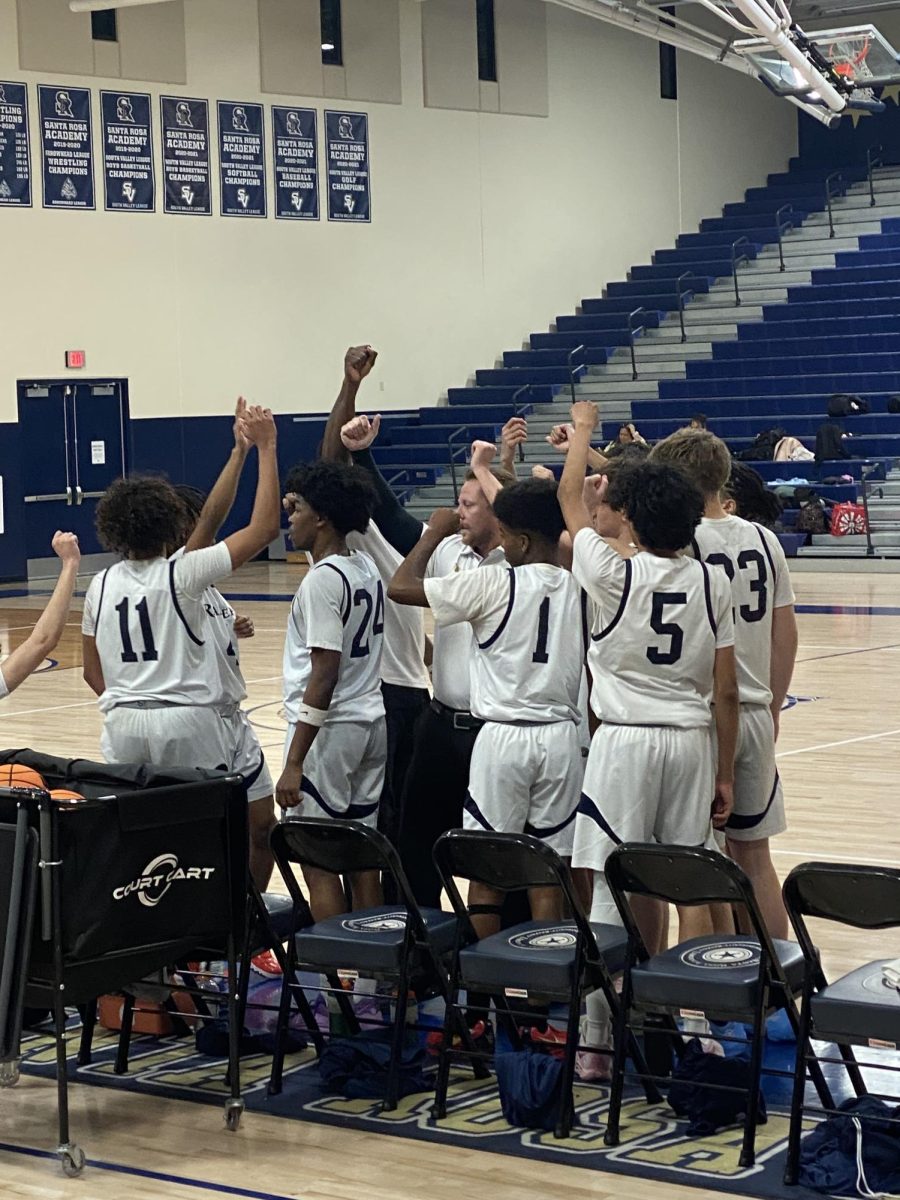 Coach Crunk breaking out the team after a quick pep talk during half time.