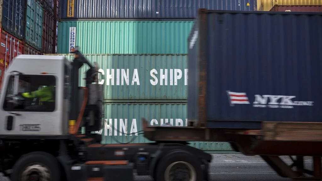 Photograph featuring Chinese cargo containership imports.