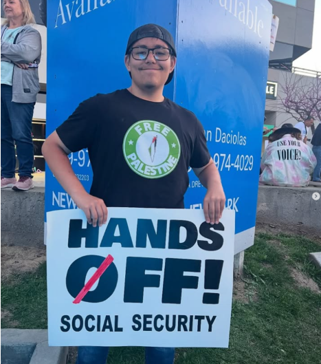 A photo of staff writer Che' Marroquin at the first Riverside #handsoff protest in April.