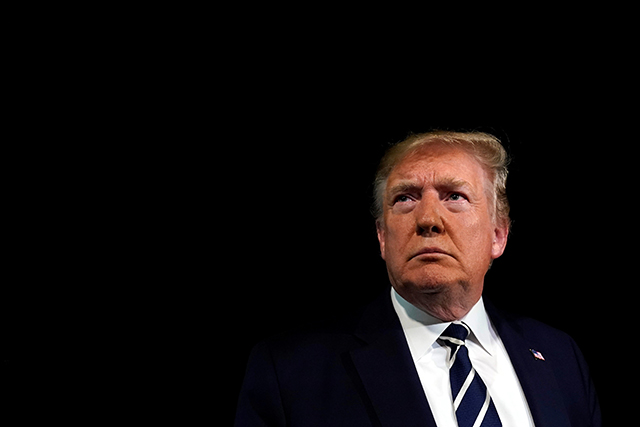 U.S. President Donald Trump listens to questions from reporters on the South Lawn of the White House in Washington, U.S., before his departure to France to attend the G7 summit in Biarritz, August 23, 2019. REUTERS/Yuri Gripas - RC1565A7EC10